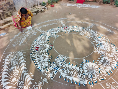 Celebration of ‘Makar Sankranti’ festival starts by painting ‘Rangoli’ with rice flour in the courtyard and women draws Sankranti Alpana in their courtyards at the outskirts of Agartala city on January 12.